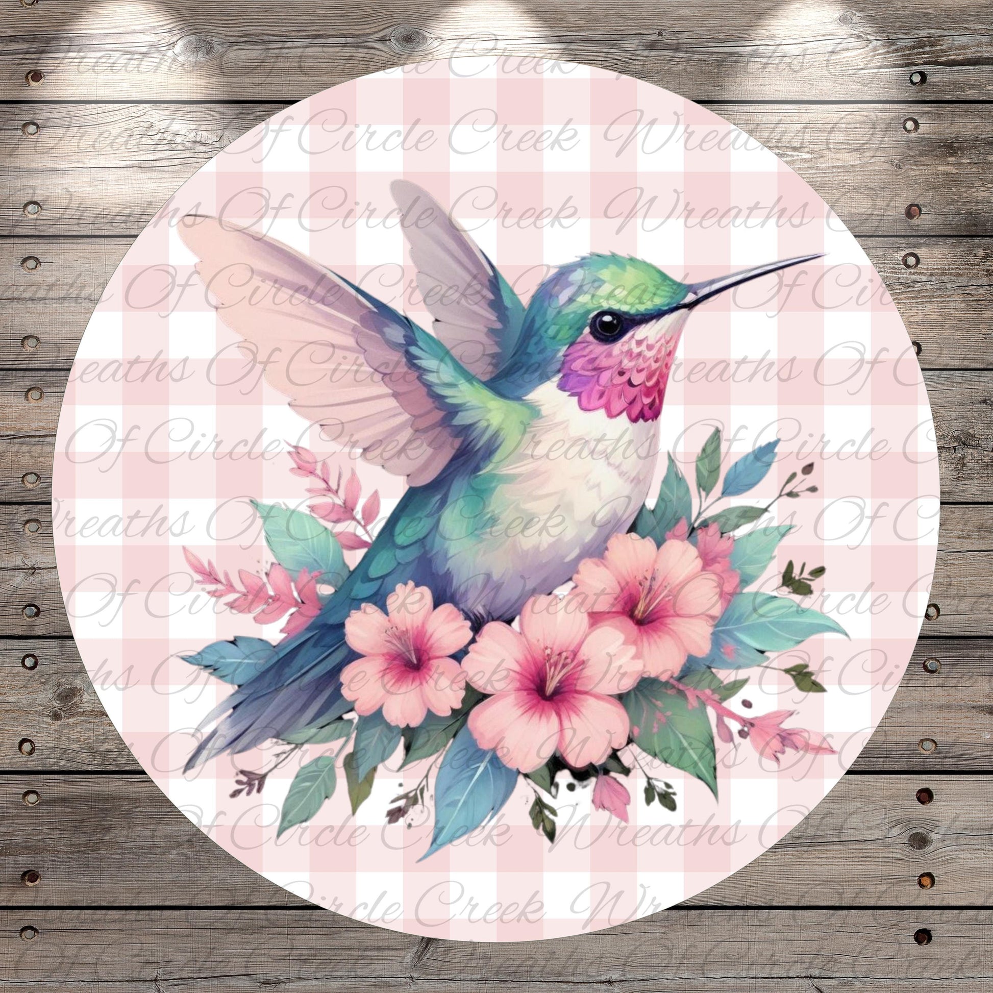 A colorful hummingbird is depicted in flight, surrounded by pink flowers and green leaves against a pink and white checkered background.