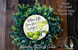 a wreath made of green leaves and a lime with a margarita glass, accompanied by the text "When life gives you limes" and "Wreaths of Circle Creek".
