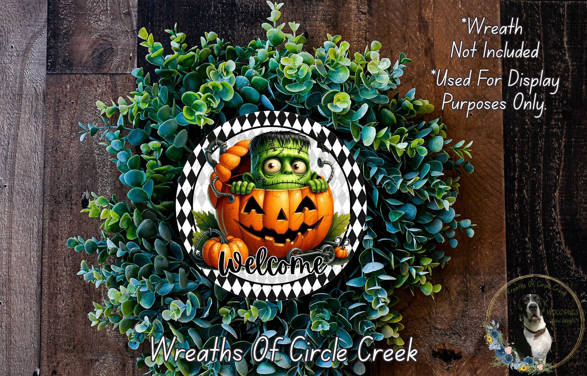 a Halloween-themed wreath with a jack-o-lantern and a green monster. The wreath is surrounded by a lush green plant and has a welcoming message.