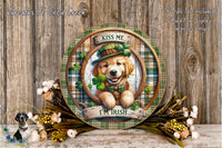 A wooden plaque with a dog wearing a green hat and holding a clover, surrounded by flowers and a plaid border.