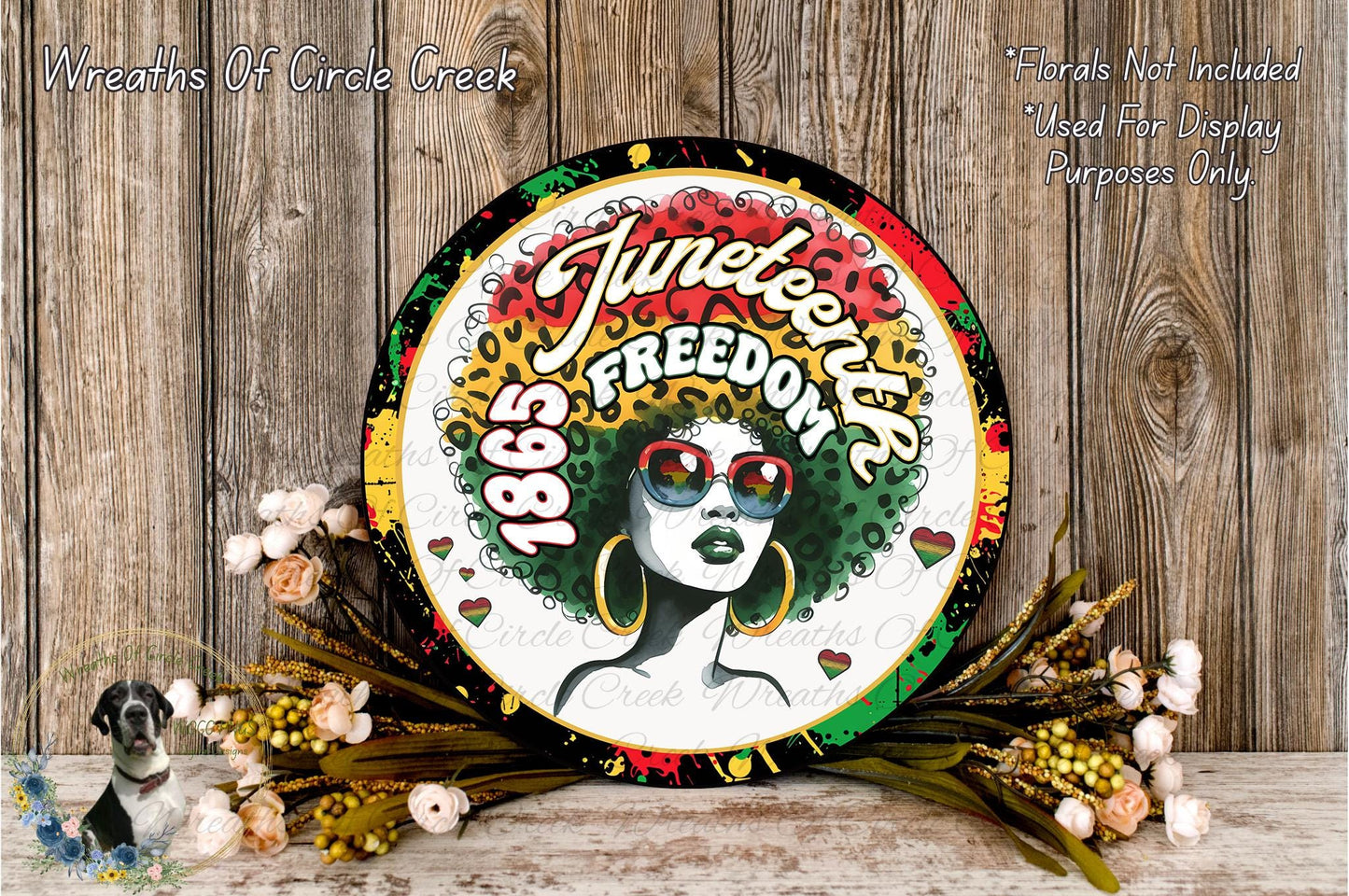 a circular sign with a woman's face and the text "Juneteenth Freedom" on it, surrounded by flowers and a wooden background.