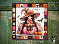 The image is a Halloween-themed illustration featuring a young girl dressed as a witch, sitting on a pumpkin and surrounded by various autumn-themed elements such as pumpkins, bats, and stars.