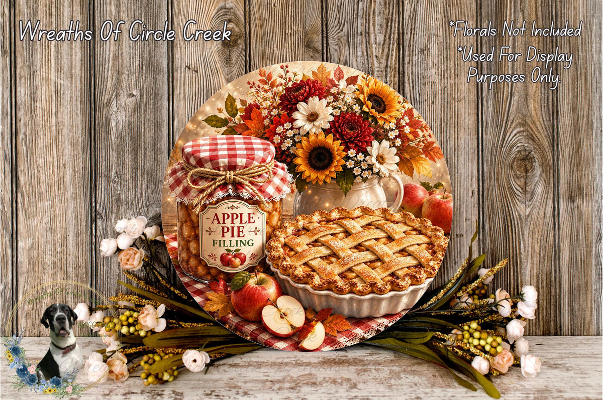 a rustic wooden table with a pie, a jar of apple pie filling, and a bouquet of flowers. The pie is placed on a white plate, and the jar of apple pie filling is next to it. The flowers are arranged around the table, creating a warm and inviting atmosphere.