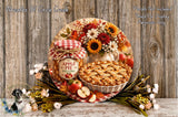 a rustic wooden table with a pie, a jar of apple pie filling, and a bouquet of flowers. The pie is placed on a white plate, and the jar of apple pie filling is next to it. The flowers are arranged around the table, creating a warm and inviting atmosphere.