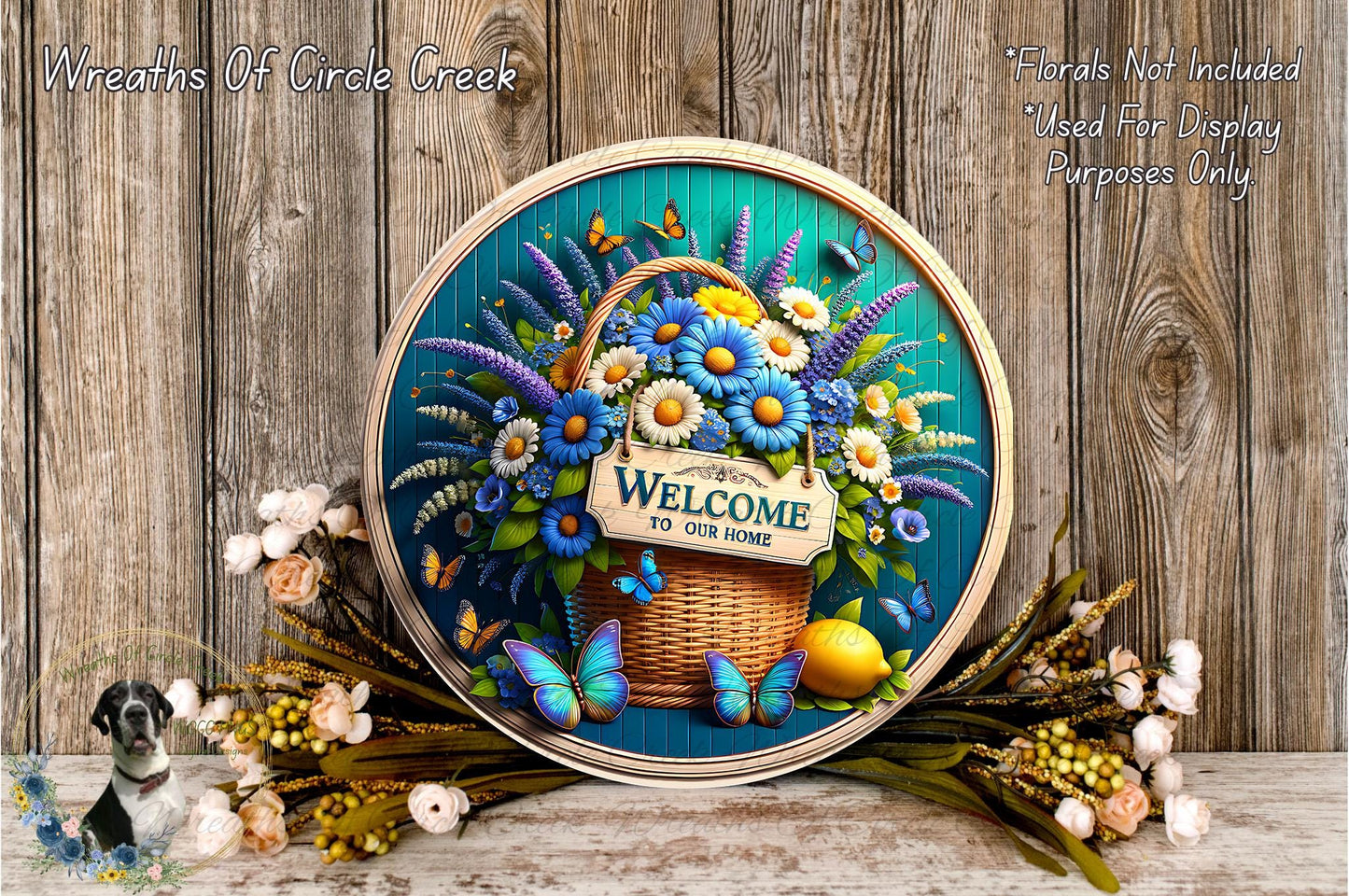 a decorative wreath with a sign that reads "Welcome to our home", surrounded by a variety of colorful flowers and butterflies. The wreath is displayed on a wooden surface, and there are additional flowers and butterflies scattered around it.
