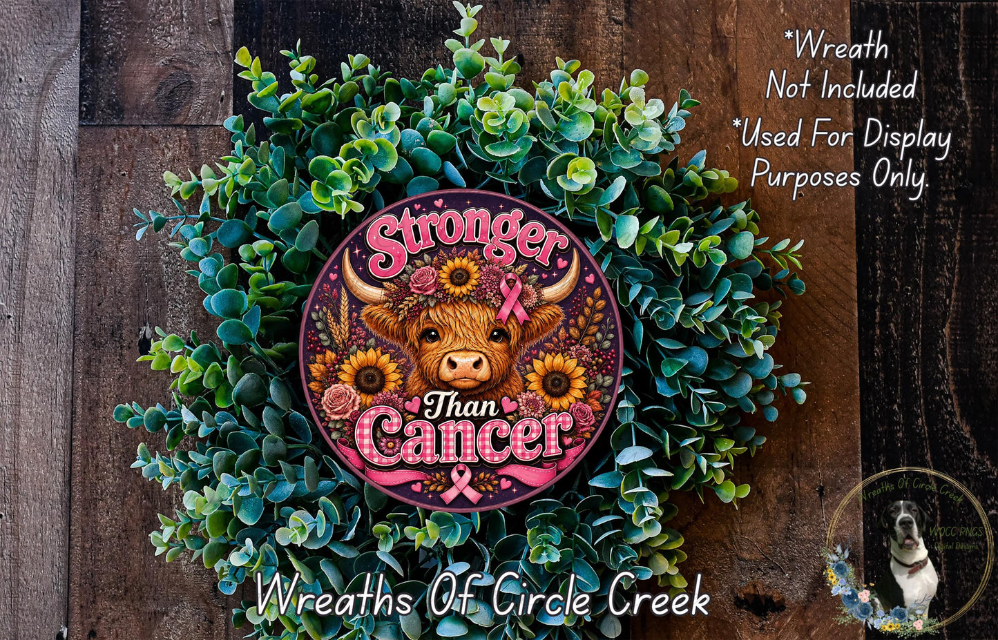 a wreath with a cow's head and the text "Stronger Than Cancer" surrounded by greenery.