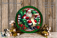 A festive Christmas wreath featuring Santa Claus sitting in a chair, holding a list, surrounded by a green and red border and a wreath of flowers.