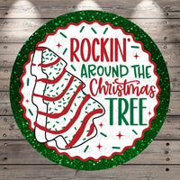 a circular Christmas tree decoration with the text "ROCKIN' AROUND THE CHRISTMAS TREE" written on it.