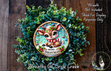 A wreath made of green leaves and a small brown reindeer with a red scarf, surrounded by a wooden background.