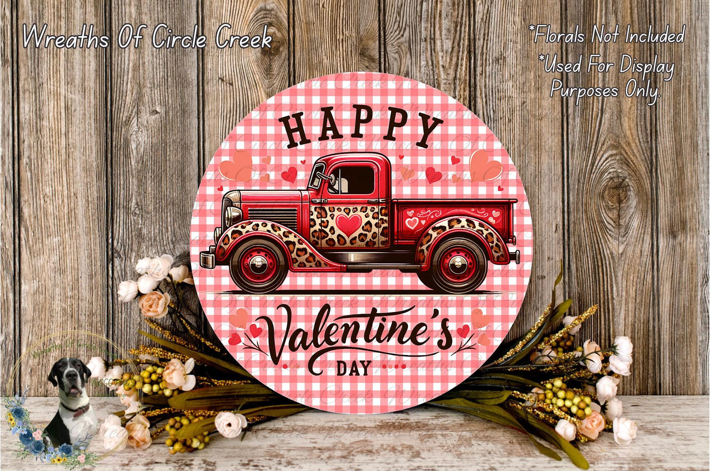 A round sign with a red truck and hearts, surrounded by flowers, with the text "Happy Valentine's Day" on it.