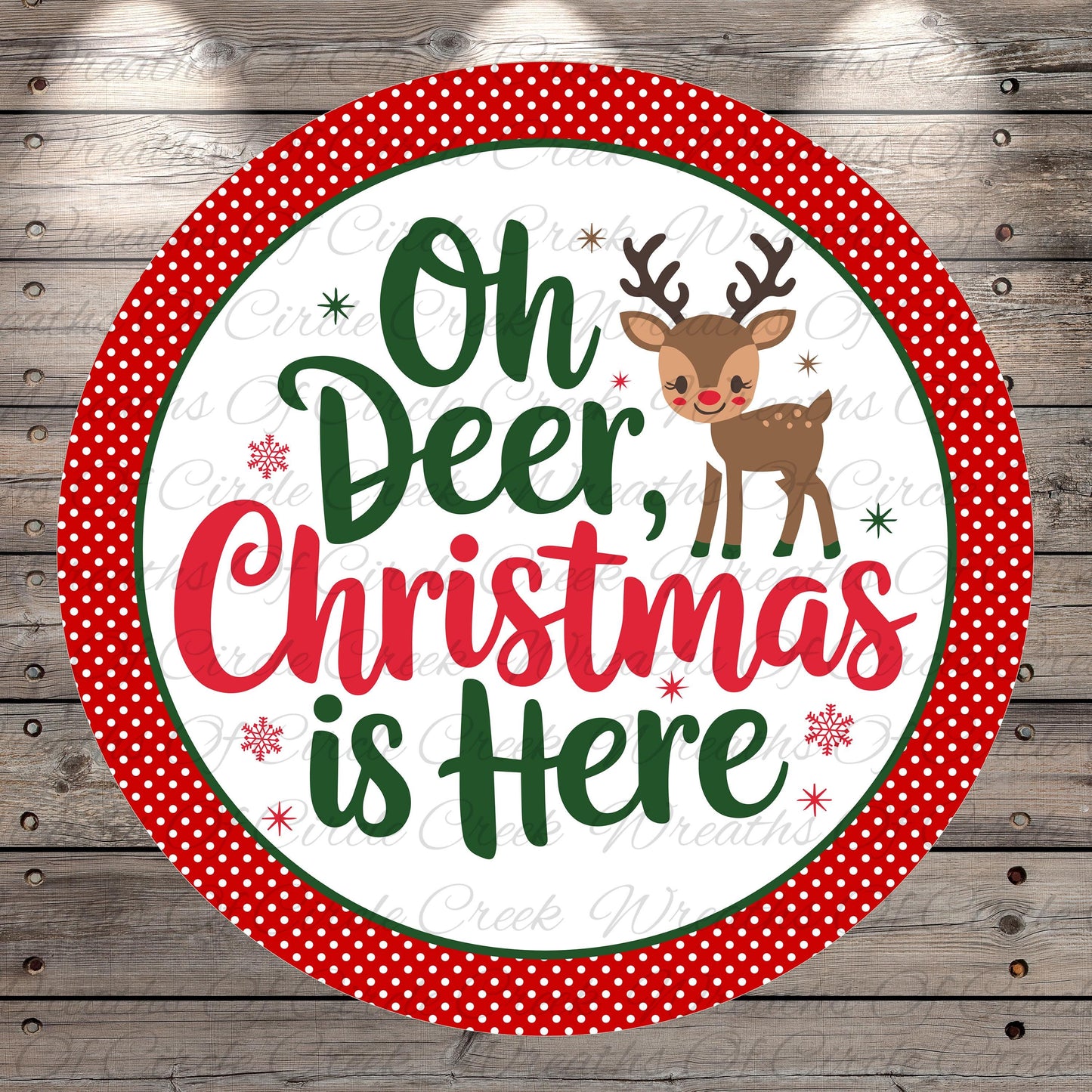 A circular sign with a red border and white background, featuring a cartoon reindeer and the text "Oh Deer, Christmas is Here" in a festive style.