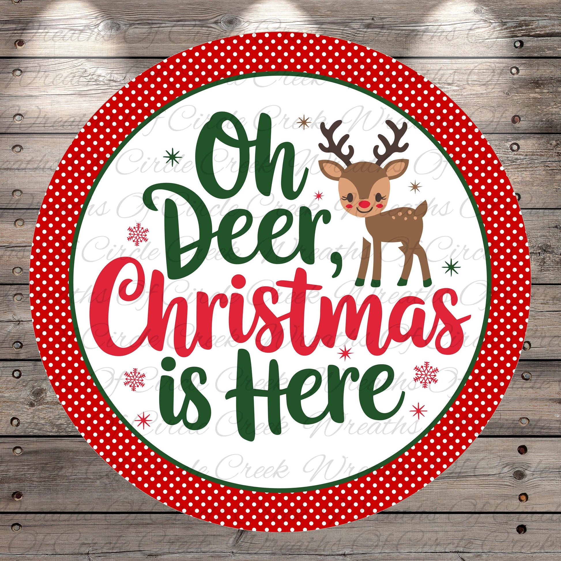 A circular sign with a red border and white background, featuring a cartoon reindeer and the text "Oh Deer, Christmas is Here" in a festive style.