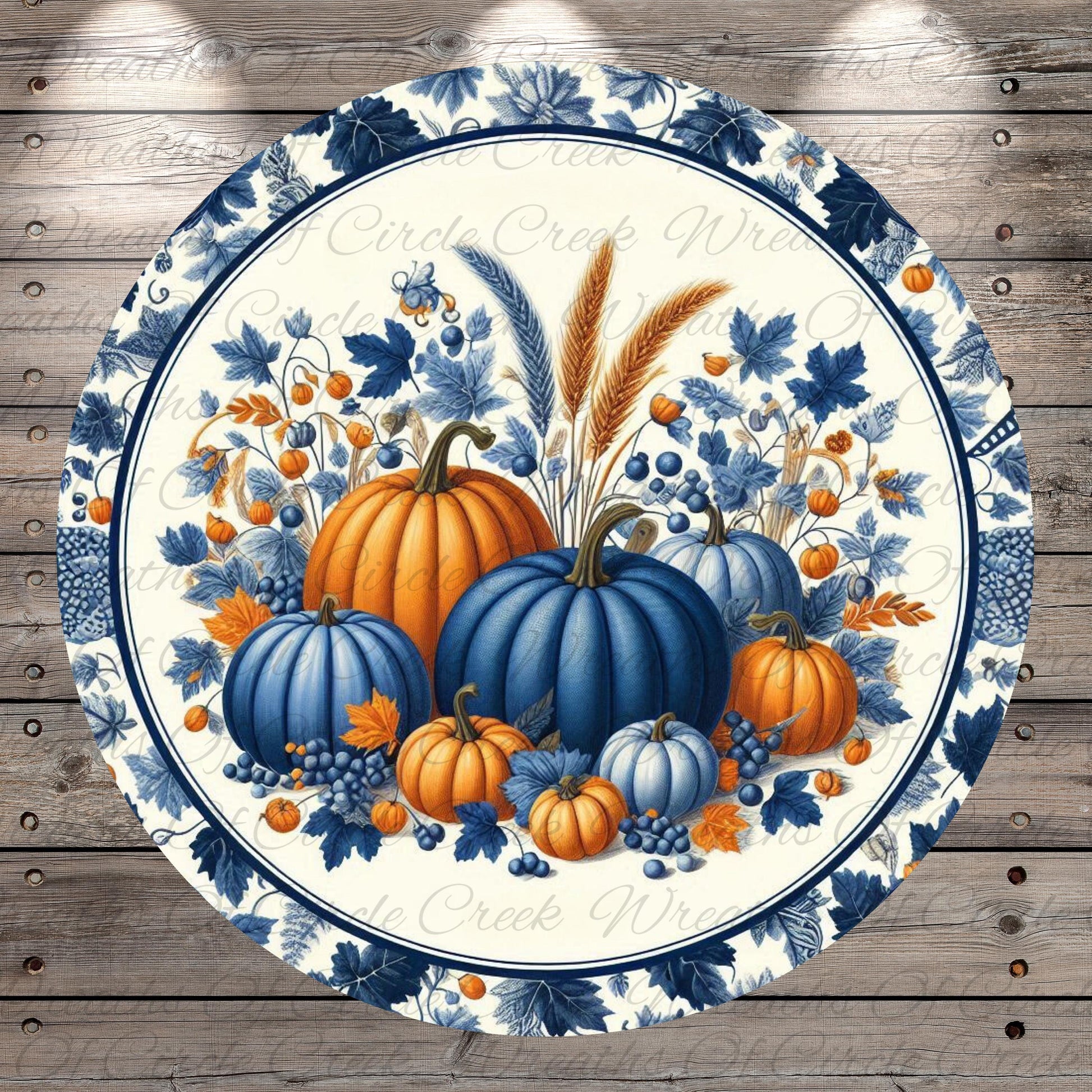 a blue and white plate with pumpkins on it