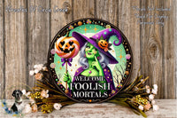 a picture of a welcome sign with a witch and pumpkin