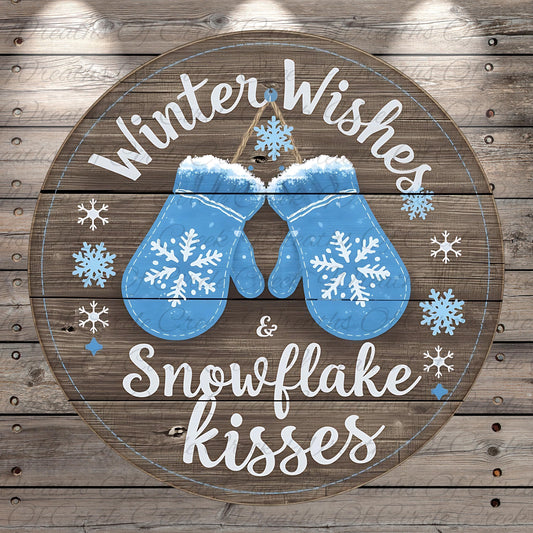 A circular wooden sign with a winter theme, featuring a pair of blue mittens and snowflakes. The sign has the text "Winter Wishes & Snowflake Kisses" written on it.