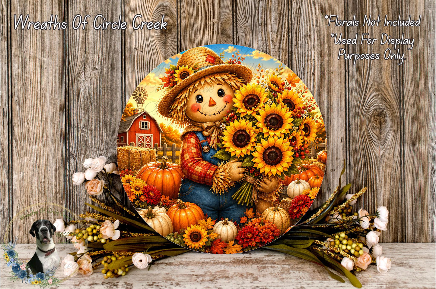 A round decorative plate featuring a scarecrow holding a bouquet of sunflowers, surrounded by autumn-themed elements such as pumpkins, gourds, and flowers.