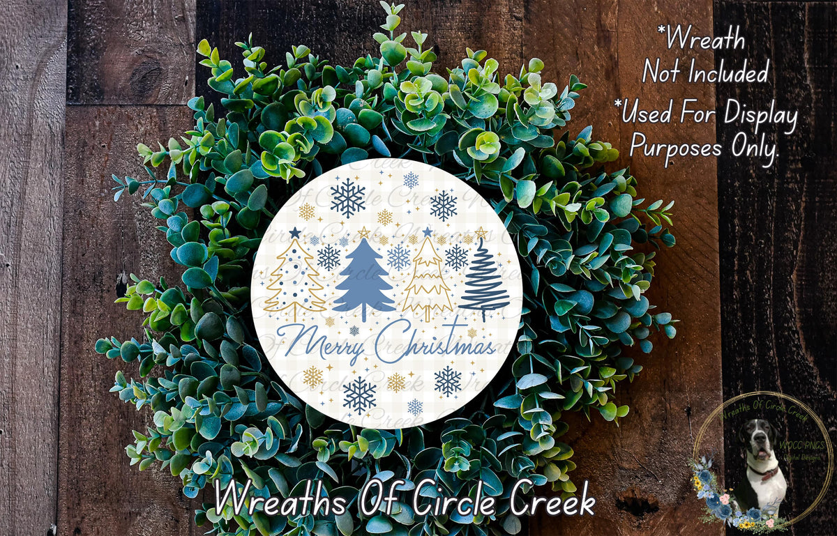 A wreath made of green foliage and white snowflakes, with a circular sign that says "Merry Christmas" in the center.