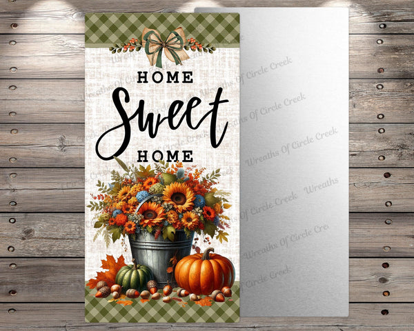 a sign that says home sweet home with pumpkins and sunflowers