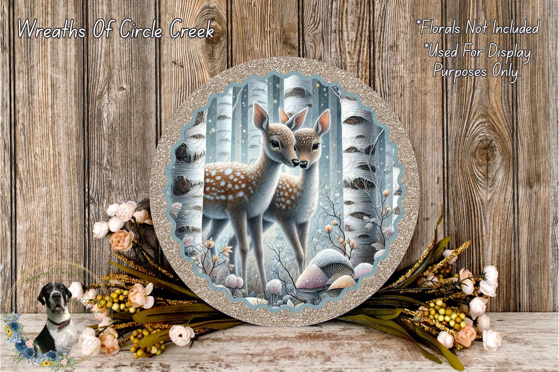 A round decorative plate featuring a deer standing in a forest setting, surrounded by flowers and greenery.