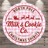 a circular logo for a company called "Milk & Cookie Co." with a Santa Claus sleigh and reindeer design. The logo is set against a pink and white checkered background.