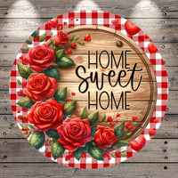 a wooden sign with the text "Home Sweet Home" written on it, surrounded by a wreath of red roses and green leaves.