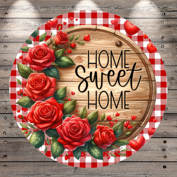 a wooden sign with the text "Home Sweet Home" written on it, surrounded by a wreath of red roses and green leaves.