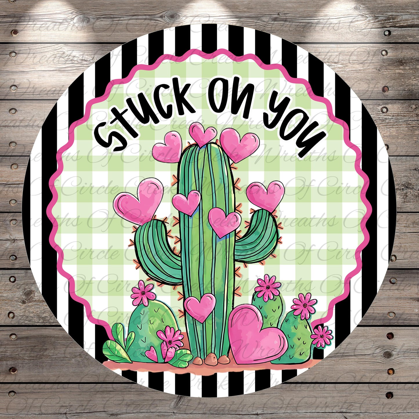 A round graphic with a cactus surrounded by pink hearts and flowers, with the text "Stuck on you" written above it.