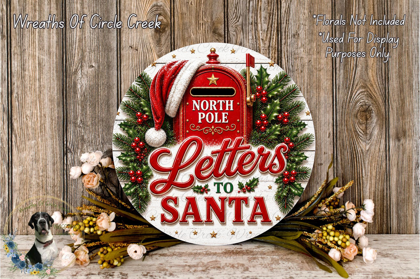 A festive wreath with a red mailbox and the text "Letters to Santa" displayed on it, surrounded by holiday decorations such as pine branches, berries, and flowers.