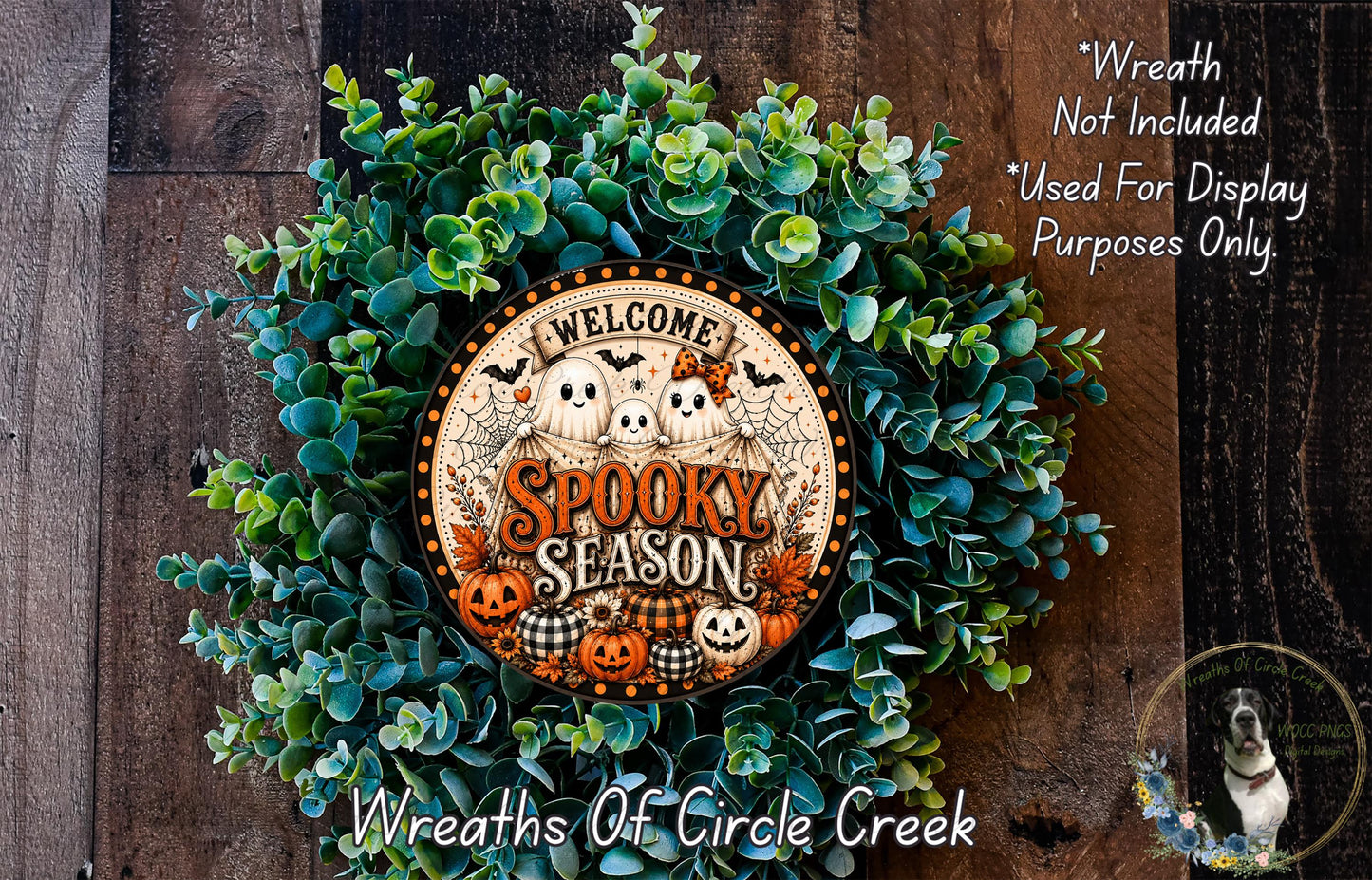 a Halloween-themed wreath made of green foliage and a circular sign that says "Welcome Spooky Season".