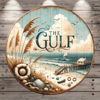The image is a circular sign with a beach scene and a boat, featuring the text "The Gulf" prominently displayed.