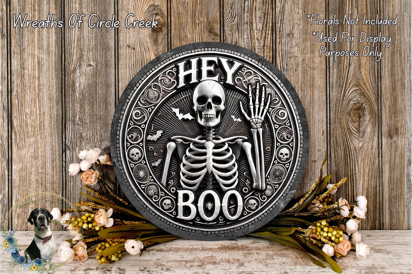 a metal plaque with a skeleton and bones on it