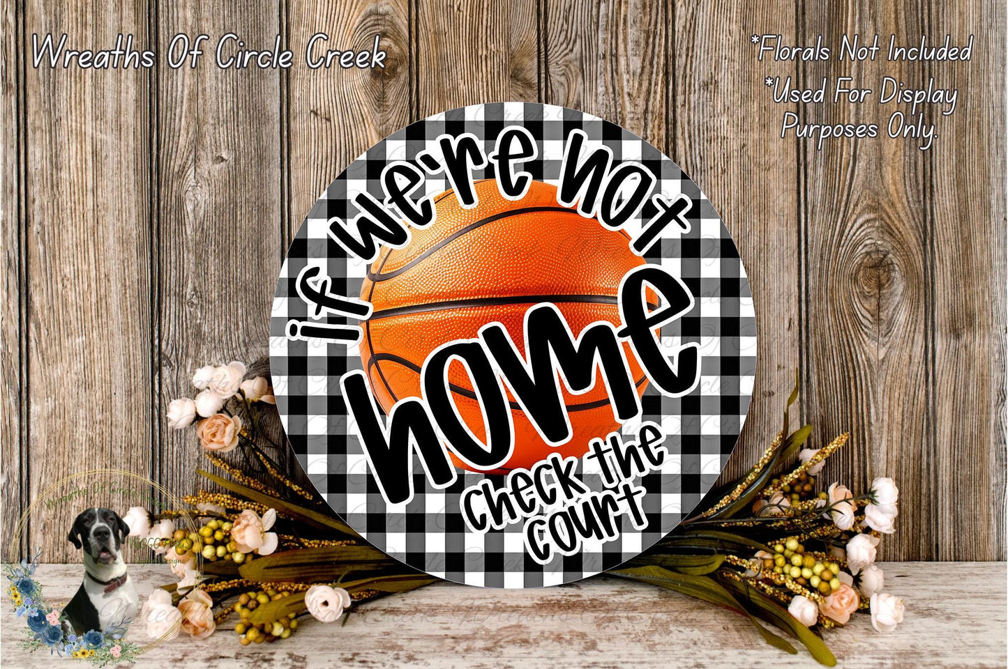 a basketball-themed sign with the text "If we're not home, check the court" displayed on it, surrounded by flowers and a wooden background.