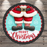 A festive Christmas-themed image featuring a pair of Santa Claus feet wearing red and white striped socks, black shoes, and a red belt, with the text "Merry Christmas" displayed on a circular frame.