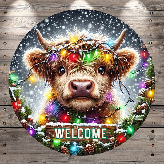 A close-up of a cow's face with a wreath of colorful lights around its horns, set against a snowy background with falling snowflakes. The word "WELCOME" is displayed in the center of the image.