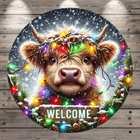 A close-up of a cow&#39;s face with a wreath of colorful lights around its horns, set against a snowy background with falling snowflakes. The word &quot;WELCOME&quot; is displayed in the center of the image.