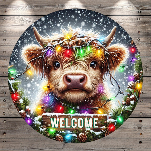 A close-up of a cow&#39;s face with a wreath of colorful lights around its horns, set against a snowy background with falling snowflakes. The word &quot;WELCOME&quot; is displayed in the center of the image.