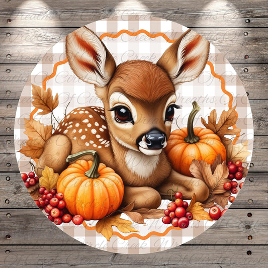 A deer with large eyes and a black nose is surrounded by pumpkins, berries, and autumn leaves, creating a festive and autumnal scene.