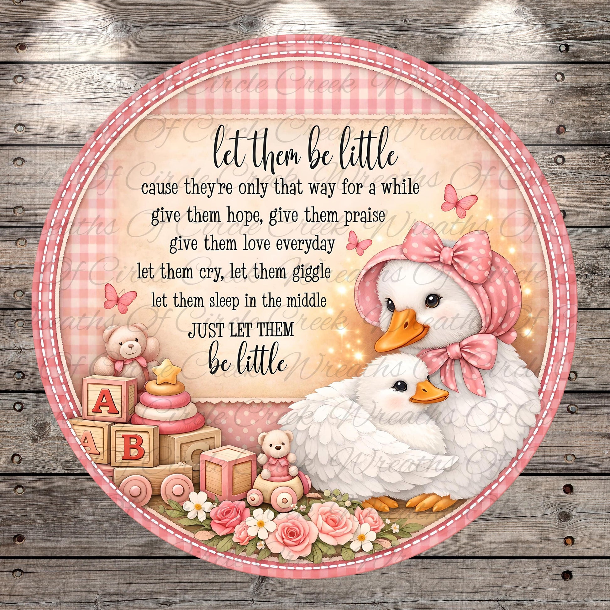 The image is a decorative piece featuring a mother duck and her ducklings surrounded by baby toys, flowers, and butterflies. The text on the image reads "let them be little, cause they're only that way for a while, give them hope, give them praise, let them cry, let them giggle, let them sleep in the middle, just let them be little".