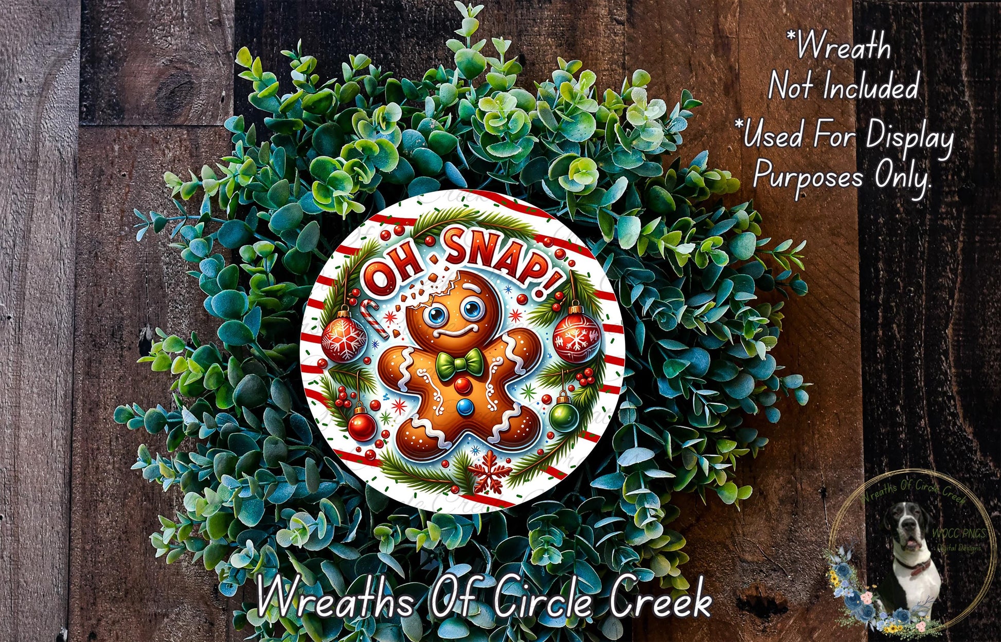 A wreath made of green plants and a gingerbread man figure with the text "OH! SNAP!" on it.