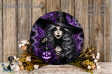 a woman with long, dark hair wearing a black hat and holding a lantern with a jack-o-lantern face on it. The background is purple and has a spooky, gothic-inspired aesthetic. The woman is surrounded by flowers and a lantern, creating a festive and Halloween-themed atmosphere.