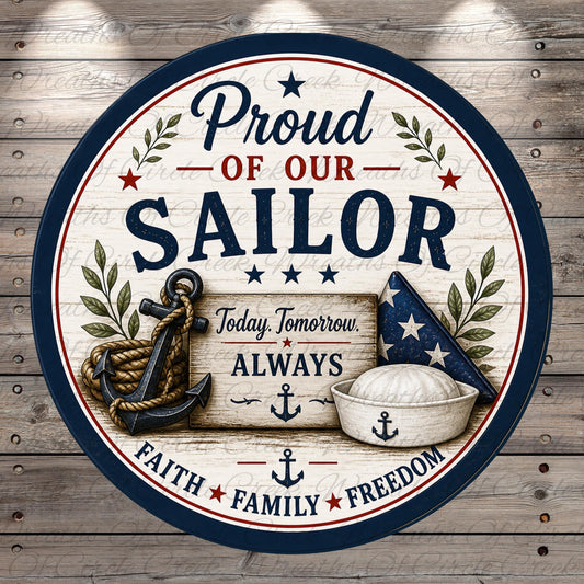 The image is a circular sign with a patriotic design featuring an anchor, a sailor hat, and the text "Proud of our Sailor" along with the phrases "Today, Tomorrow, Always" and "Faith * Family * Freedom".
