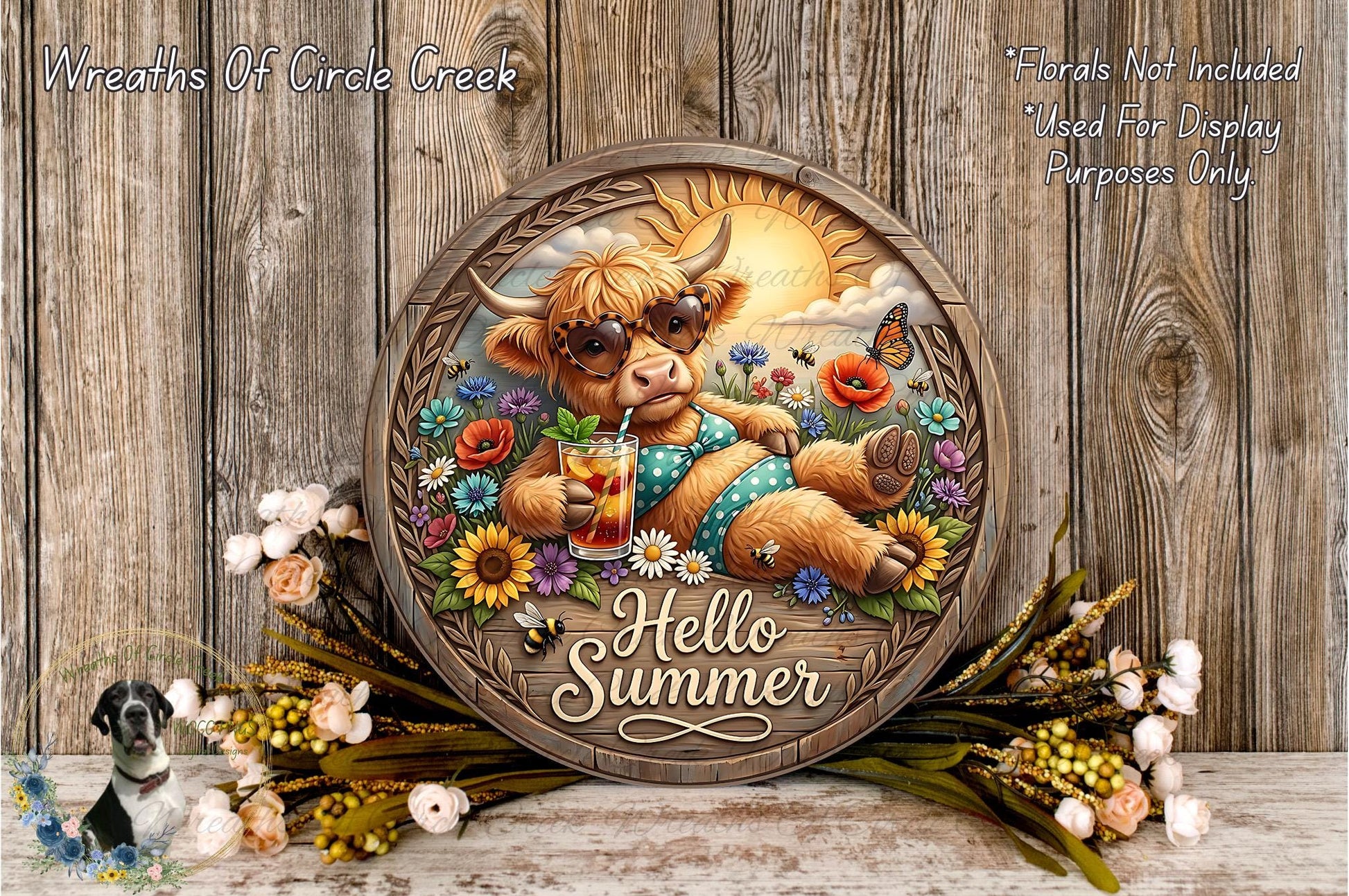 A wooden sign with a cow wearing sunglasses and holding a drink, surrounded by flowers and a sun. The sign says "Hello Summer".