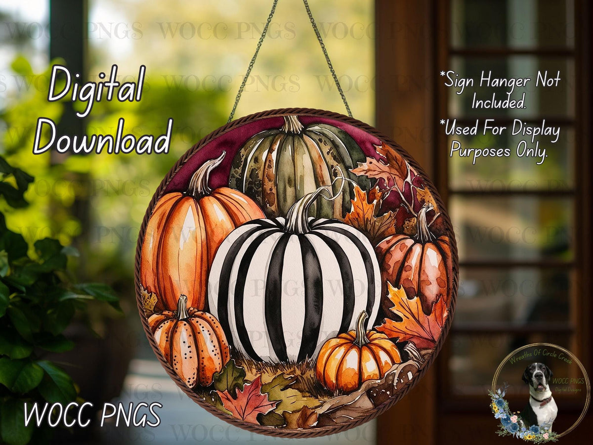 a glass hanging ornament decorated with pumpkins and gourds