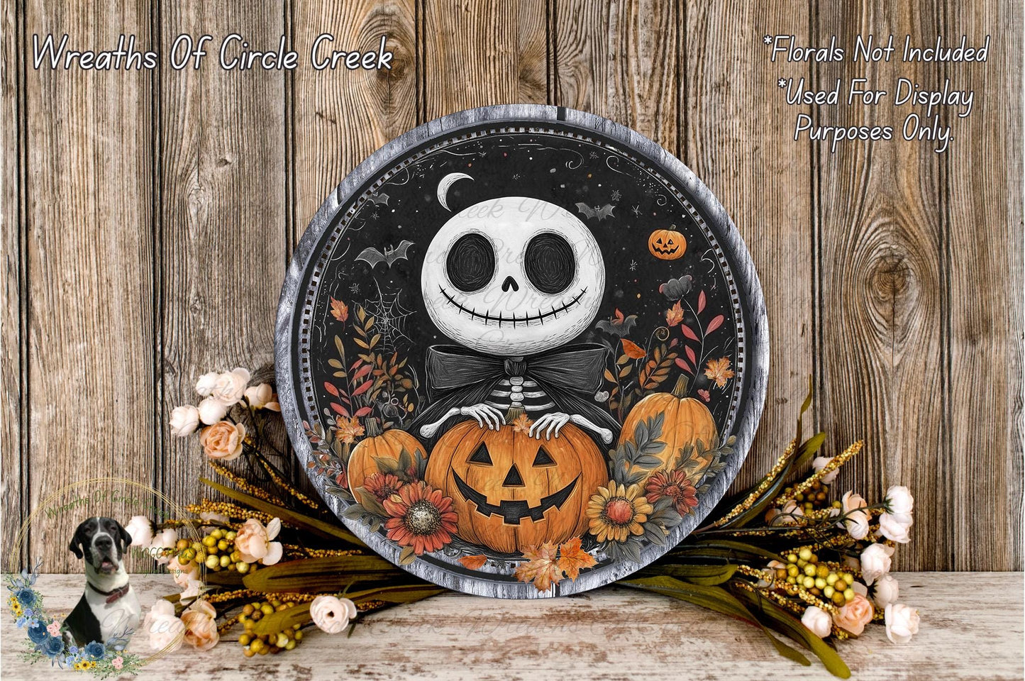 a Halloween-themed wreath with a skeleton holding a jack-o-lantern, surrounded by autumn flowers and a wooden background.