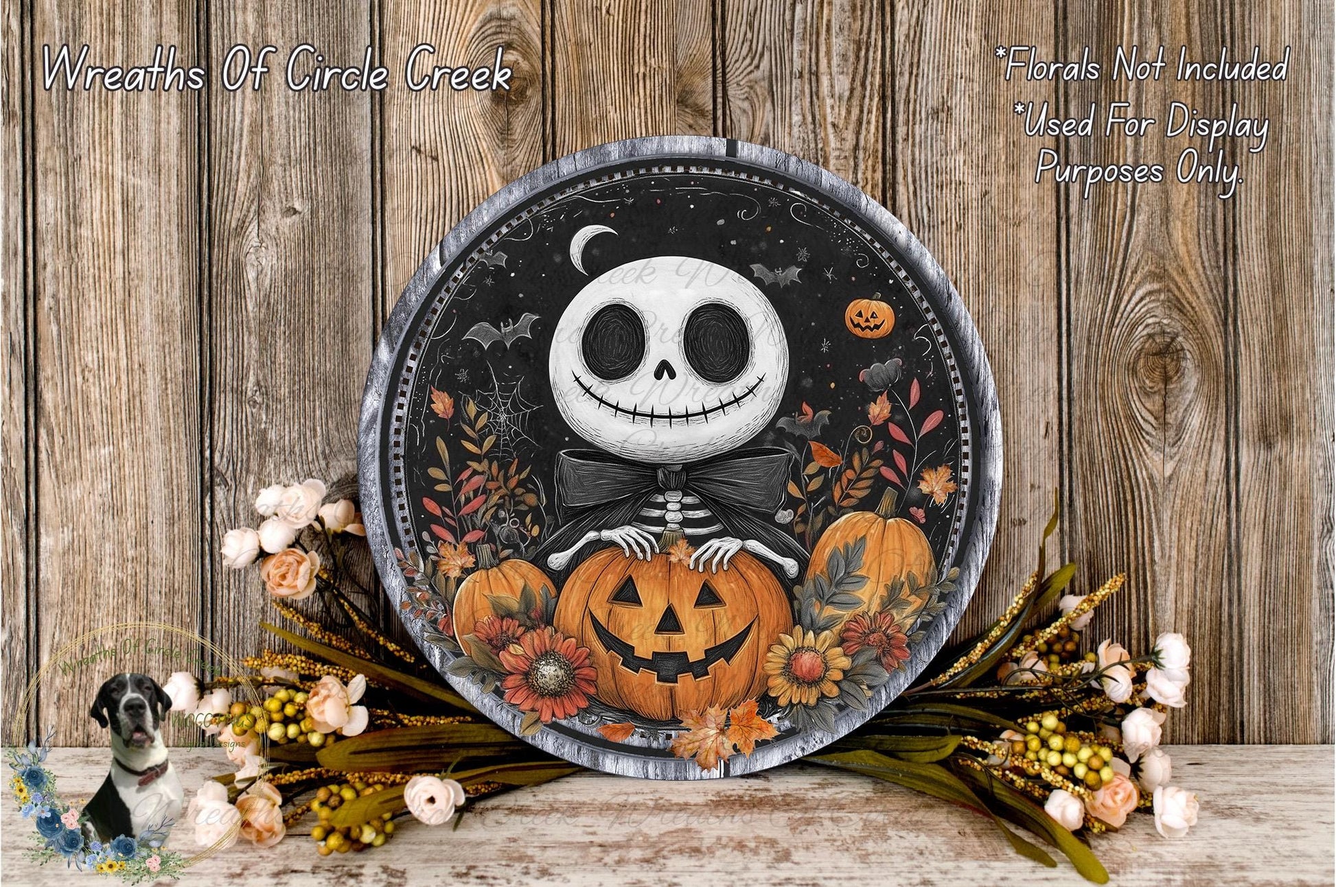 a Halloween-themed wreath with a skeleton holding a jack-o-lantern, surrounded by autumn flowers and a wooden background.