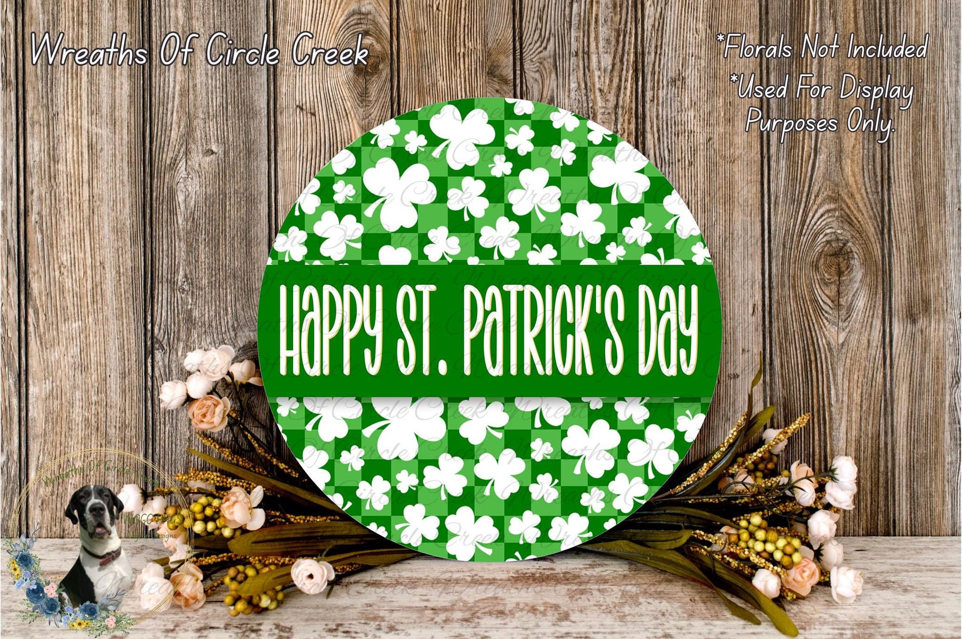 a circular sign with the text "Happy St. Patrick's Day" displayed on it, surrounded by a wreath of flowers and a wooden background.