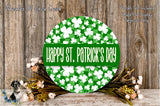 a circular sign with the text "Happy St. Patrick's Day" displayed on it, surrounded by a wreath of flowers and a wooden background.