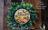 A wreath made of various green plants and flowers, with a sign that says "Hello Summer" in the center.