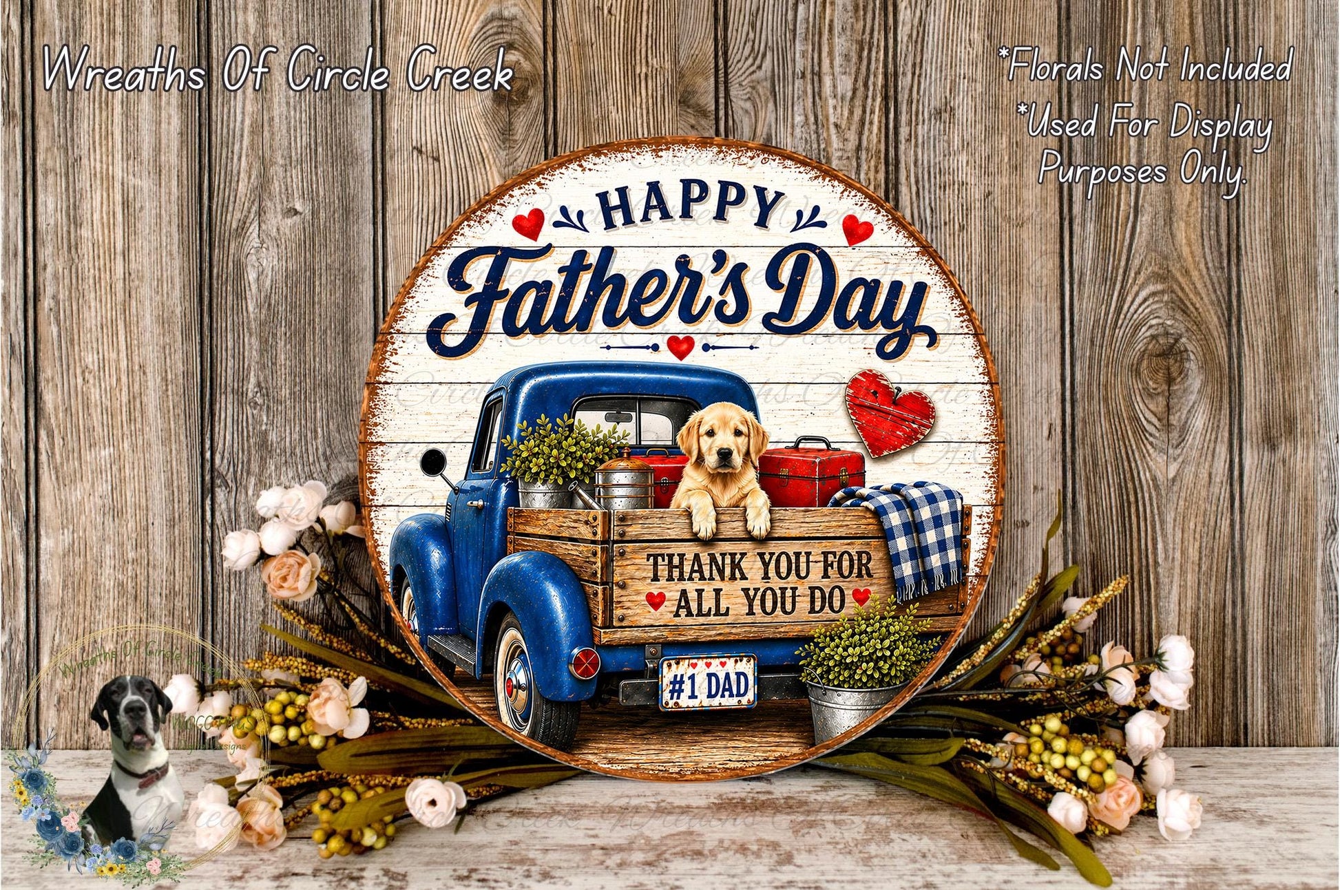 A round wooden sign with a blue truck and a dog, surrounded by flowers and a plaque with the text "Happy Father's Day" and "Thank You For All You Do".