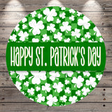 A circular sign with a green background and white clovers, along with the text "Happy St. Patrick's Day" written in a stylized font.